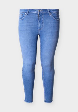 Jasnoniebieskie, obcisłe jeansy z wysokim stanem, z przodu na suwak i guzik, z pięcioma kieszeniami oraz postrzępionymi brzegami.