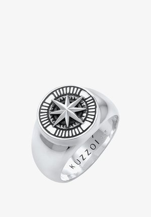 Silver ring featuring a compass design with a prominent star detail, textured background, and smooth band. Marked with "KUZZOI 925."