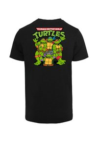 Black cotton t-shirt featuring a colorful graphic of four Teenage Mutant Ninja Turtles on the back, with bold text above.