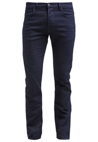 Slim-fit tummansinisiä farkkuja, jotka on valmistettu pehmeästä puuvillamateriaalista ja joissa on viisi taskua, nappi- ja vetoketjukiinnitys sekä huomaamatonta ommelta.