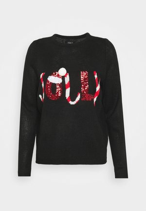 Pull en tricot noir à manches longues avec "JOLLY" en sequins rouges et blancs, motif de canne à sucre rayée et accent en pompon blanc.