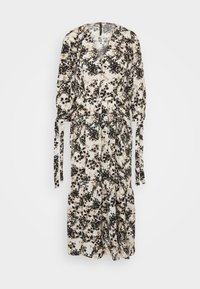 Kukkaprintillä oleva kermanvalkoinen, musta ja beige kietaisumekko. Siinä on pitkät hihat, sidottava vyötärö ja löysä, valuva hame.