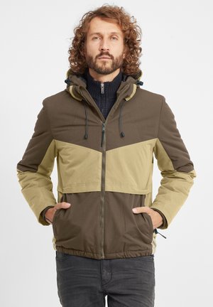 Color-blocked jacket in olive green and brown, featuring a hood, front pockets, and a zip closure. Fabric appears textured and durable.
