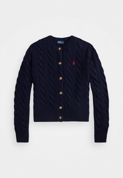 Navy blue cable-knit cardigan with brown buttons and red embroidered logo on left chest, long sleeves, and ribbed cuffs and hem.
