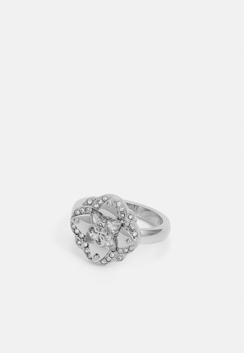 Silver ring with an intricate openwork design, featuring a central stone and surrounding smaller stones set in a floral pattern.