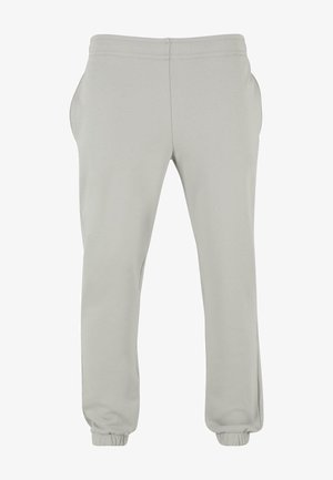 Pantalones jogger de color gris claro con cintura elástica, bolsillos laterales y puños elásticos en los tobillos. Confeccionados con una tela suave y elástica.