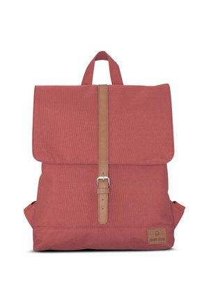 Red canvas backpack with a fold-over flap, a tan leather strap and buckle closure, and a side pocket. Features a logo patch on the base.