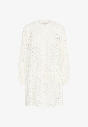 Vit bomullsblus med knapp-up framtill, rund halsringning och puffärmar. Har utskurna bladmönster och en rynkad midja.