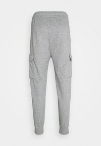 Grå sweatpants med en tapered design, elastisk midja och sidofickor. Tillverkade av mjukt material med ribbad muddar vid anklarna.