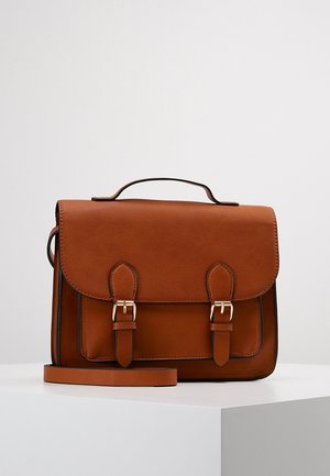Brown faux leather satchel bag with a flap, gold-tone buckles, and a detachable strap. Features contrasting seams and a structured shape.