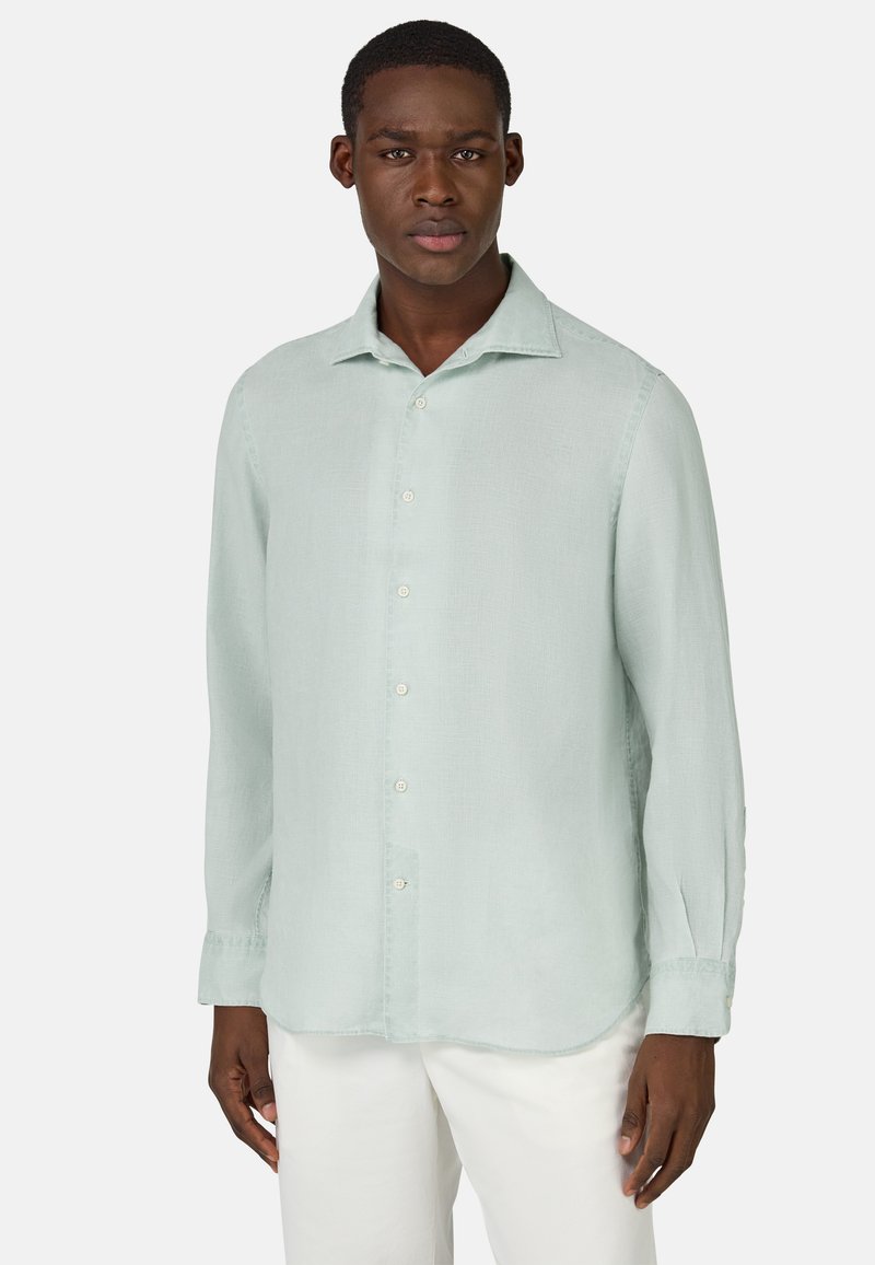Camicia a maniche lunghe verde chiaro con colletto abbottonato, realizzata in un tessuto testurizzato. Presenta un orlo dritto e polsini con un solo bottone.