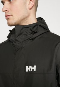 Helly Hansen ERVIK - Regenjas - black