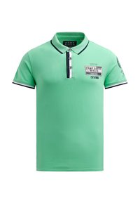 Green polo shirt with black and white accents, featuring a collar, three-button placket, and a logo patch on the front. Short sleeves.