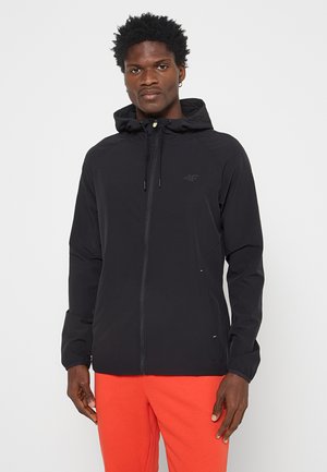 Czarna kurtka z kapturem, z zamkiem z przodu, posiadająca elastyczne mankiety i minimalistyczny design. Podkreślona małym logo na piersi.