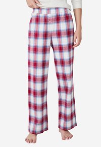 Rode en witte geruite pyjamabroek van zachte stof, met een elastische tailleband en een ontspannen pasvorm. Minimalistische knoopdetails op de tailleband.