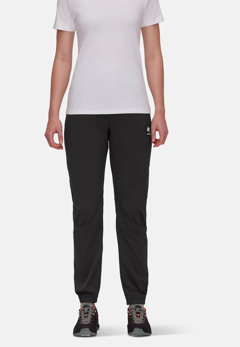 Schwarze, leichte Hosen mit schmaler Passform und elastischen Bündchen, die über schräg verlaufende Nähte und ein Logopatch auf der Vorderseite verfügen.