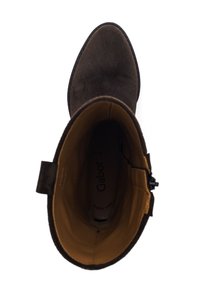 Brown suede ankle boot with a rounded toe and a soft, textured surface; features a tan interior lining and a side zipper for closure.