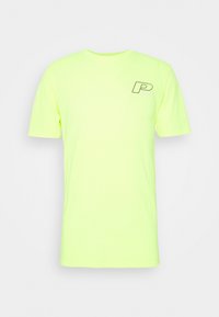 Neon žluté bavlněné tričko s krátkým rukávem, kulatým výstřihem a černým logem vytištěným na levé části hrudi. Měkká, lehká tkanina.