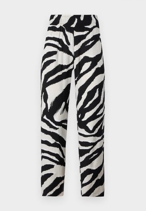 Sort/hvide zebra mønsterbukser med elastisk talje, lige pasform og blød tekstur, der har markante, kontrasterende striber.