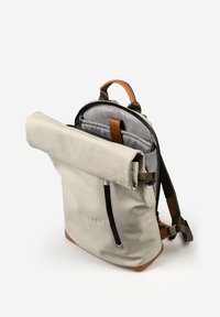 Beige roll-top backpack with a tan leather base. Features a black zipper, adjustable straps, and a textured gray inner lining.