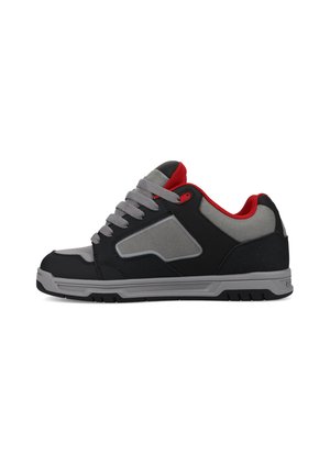 Black and gray sneakers with red accents, featuring a padded collar, grey laces, and a textured rubber sole. Casual athletic design.