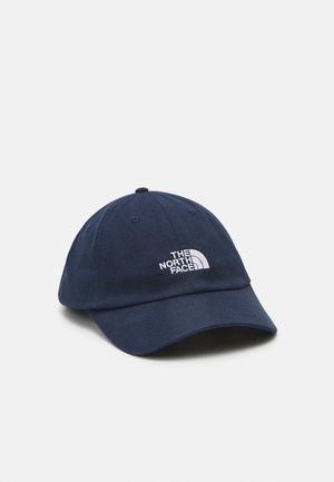 Navy blue baseball cap made of cotton twill, featuring a prominent white embroidered logo on the front and a curved visor.