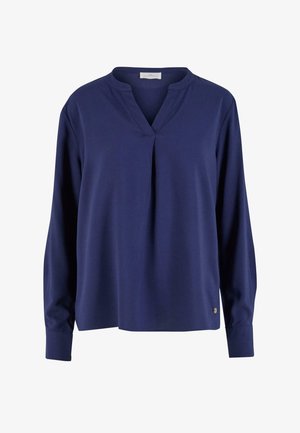 Blusa blu navy a maniche lunghe con scollatura a V, dettaglio plissettato davanti e polsini con bottoni. Tessuto morbido con una consistenza liscia.