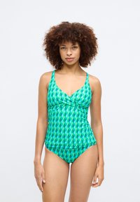 Green patterned swimsuit with a camisole-style top, featuring a v-neck, wide straps, and matching bikini bottom in geometric shapes.