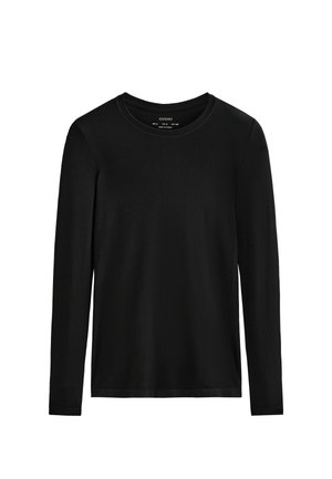 Chemise noire à manches longues en tissu doux. Dotée d'un col rond et d'un design simple et ajusté, sans motifs ni embellissements.