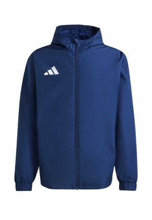 Marineblaues Windbreaker-Jacke mit einem Frontreißverschluss, Kapuze, elastischen Bündchen und einem weißen Logo auf der linken Brust. Leicht und mit glatter Textur.