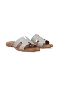 Gray textured slide sandals with open toe and cut-out design, featuring a flat tan sole for comfort. Simple and modern aesthetic.