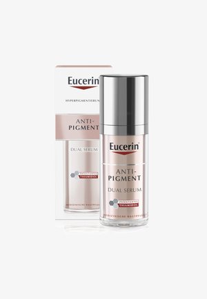 Eucerin Anti-Pigment Dual Serum in einer transparenten Pumpflasche mit einem silbernen Deckel. Die Box hat ein weißes und pinkes Design, Beschriftungen und hexagonale Grafiken.