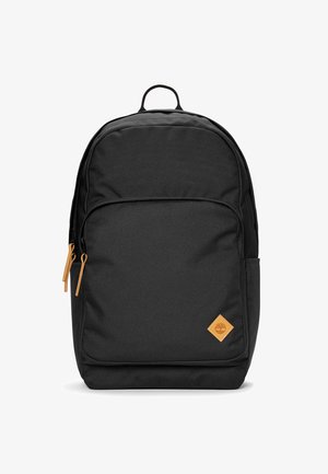 Zaino in tessuto nero dalla forma rettangolare, con tirazip in pelle e un patch con logo a forma di diamante in marrone. Include una tasca laterale.