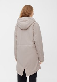 Lichtbeige lange jas met een capuchon, met een gladde textuur, rechte snit, zijzakken en een gespleten zoom aan de achterkant.