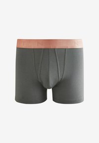 Szürke pamut boxer alsónadrág, rózsaarany elasztikus derékkal, amelyen emboszált logó található. A design elülső zsebet és varrás nélküli oldalakat tartalmaz.
