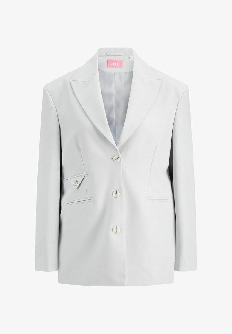 Helehall hõlmikujulise mündiga jakk, ühe nupuga kinnitusega, kahe eesmise taskuga ning lisaks kaldu taskudetail vasakul küljel.