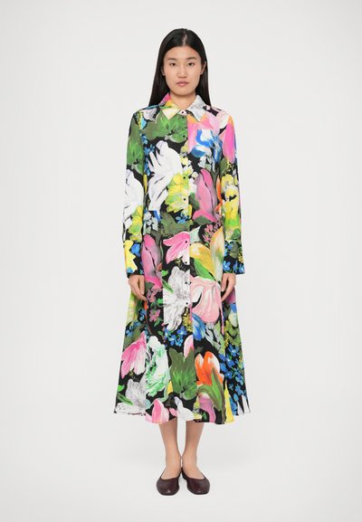 Floral dress featuring vibrant colors like pink, green, and yellow on a black background. Long sleeves and a collared neckline with buttons.