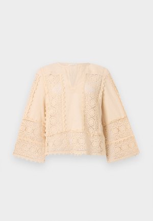Beige Baumwolloberteil mit weiten Ärmeln und aufwendigen Spitzendetails am Saum und den Ärmeln. Verfügt über einen V-Ausschnitt und dekorative Nahtabschlüsse.