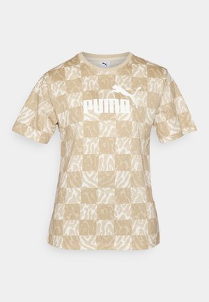 Vaaleanbeige kuvioitu lyhythihainen t-paita, jossa on palikkamainen design, valkoinen "PUMA"-logo ja teksturoidut elementit kevyessä materiaalissa.