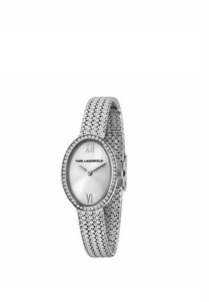 Orologio ovale di lusso in argento con lunetta tempestata di cristalli, cinturino in metallo intrecciato e quadrante minimalista che mostra le 10:10 e il logo Karl Lagerfeld.