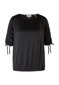 Chemise noire à manches courtes avec manches froncées et liens réglables, encolure ronde et ourlet élastique, fabriquée en tissu lisse.