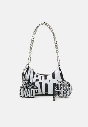 Black and white Steve Madden handbag with large logo print, detachable chain strap, fabric shoulder strap, and round coin purse with zipper.