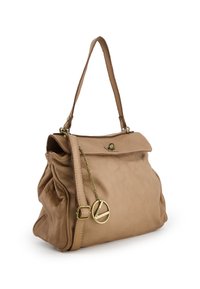 Light brown leather handbag with a structured design, featuring a top flap, a short strap, and a decorative chain with a circular charm.