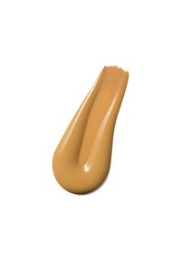 Beige flytende foundation med en glatt, litt skinnende tekstur, formet som en buet dråpe, som viser en varm undertone.