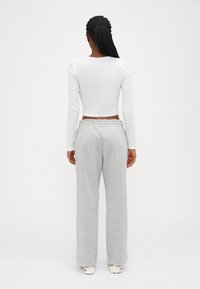 GAP Petite HERITAGE - Treniņtērpa apakšdaļas - light heather grey
