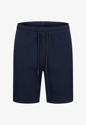 Marineblaue Shorts aus strukturiertem Stoff mit elastischem Bund und Kordelzug. Besitzt einen lockeren Schnitt und eine Länge über dem Knie.
