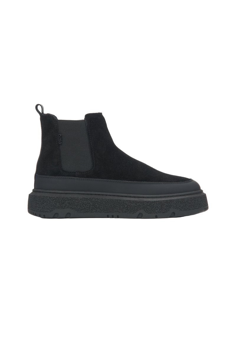 Black suede ankle boots feature elastic side panels, a thick, textured sole, and a pull tab at the heel for easy wear.