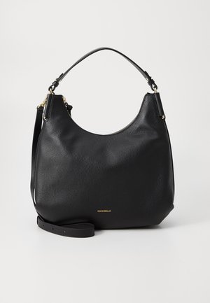 Black leather shoulder bag with a textured finish, curved design, and a single top handle. Features a gold logo at the front and adjustable strap.