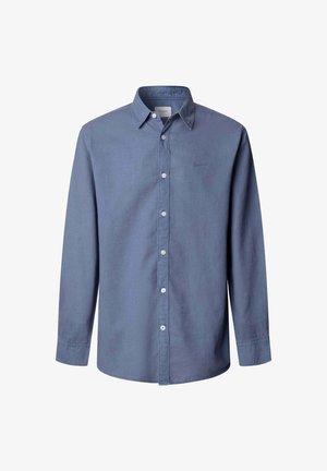 Chemise pour homme à manches longues, boutonnée, de couleur bleue unie avec un col pointu et des boutons blancs sur le devant.