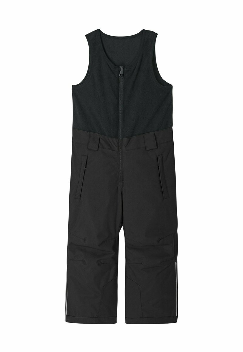 Overall de nieve negro, aislante, con parte delantera con cremallera, sin mangas y dos bolsillos. Presenta rodilleras reforzadas y acentos reflectantes.